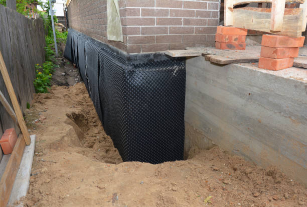 Happy homeowners after waterproofing job in Tilton